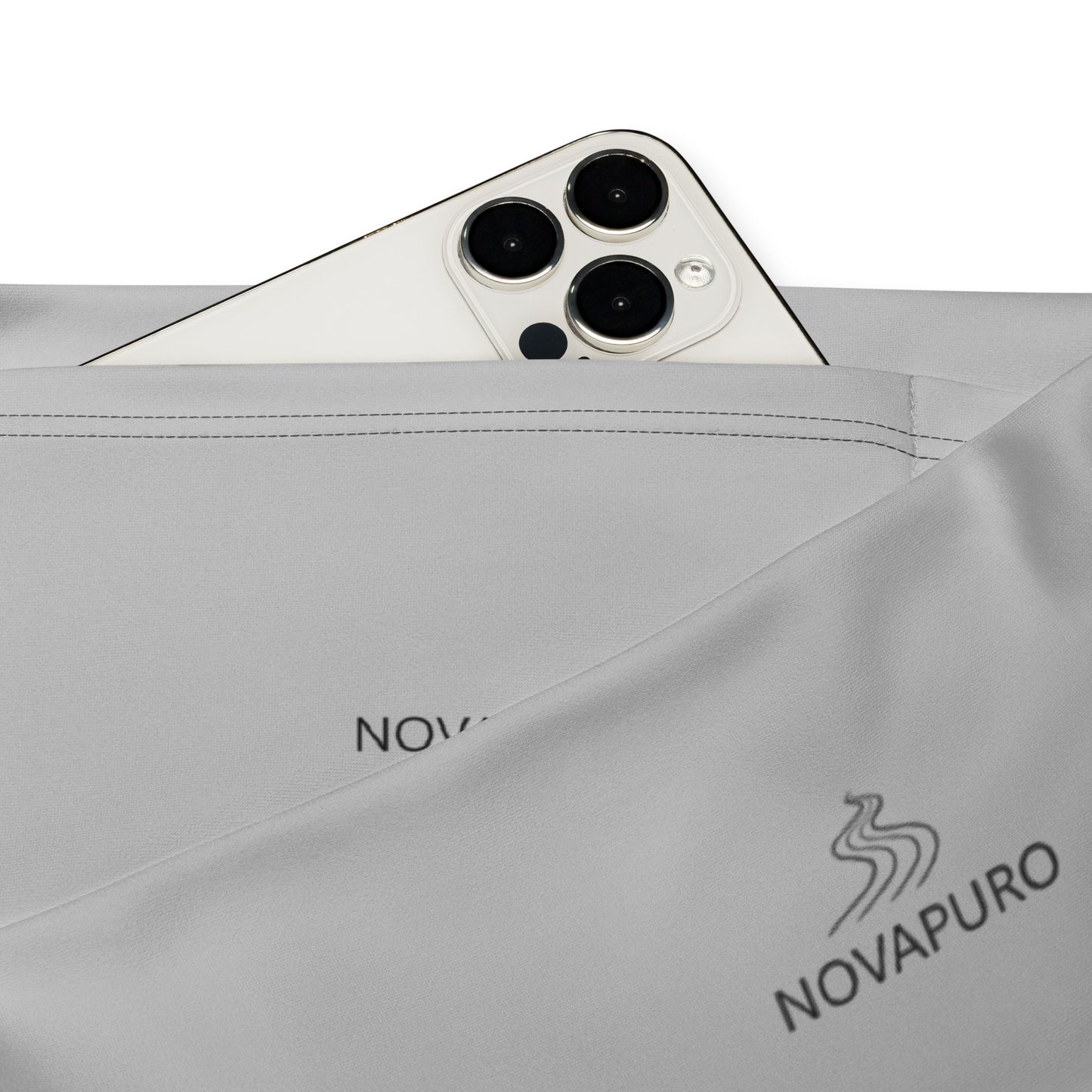 Close-up of the minimalist Novapuro logo on grey recycled flare leggings