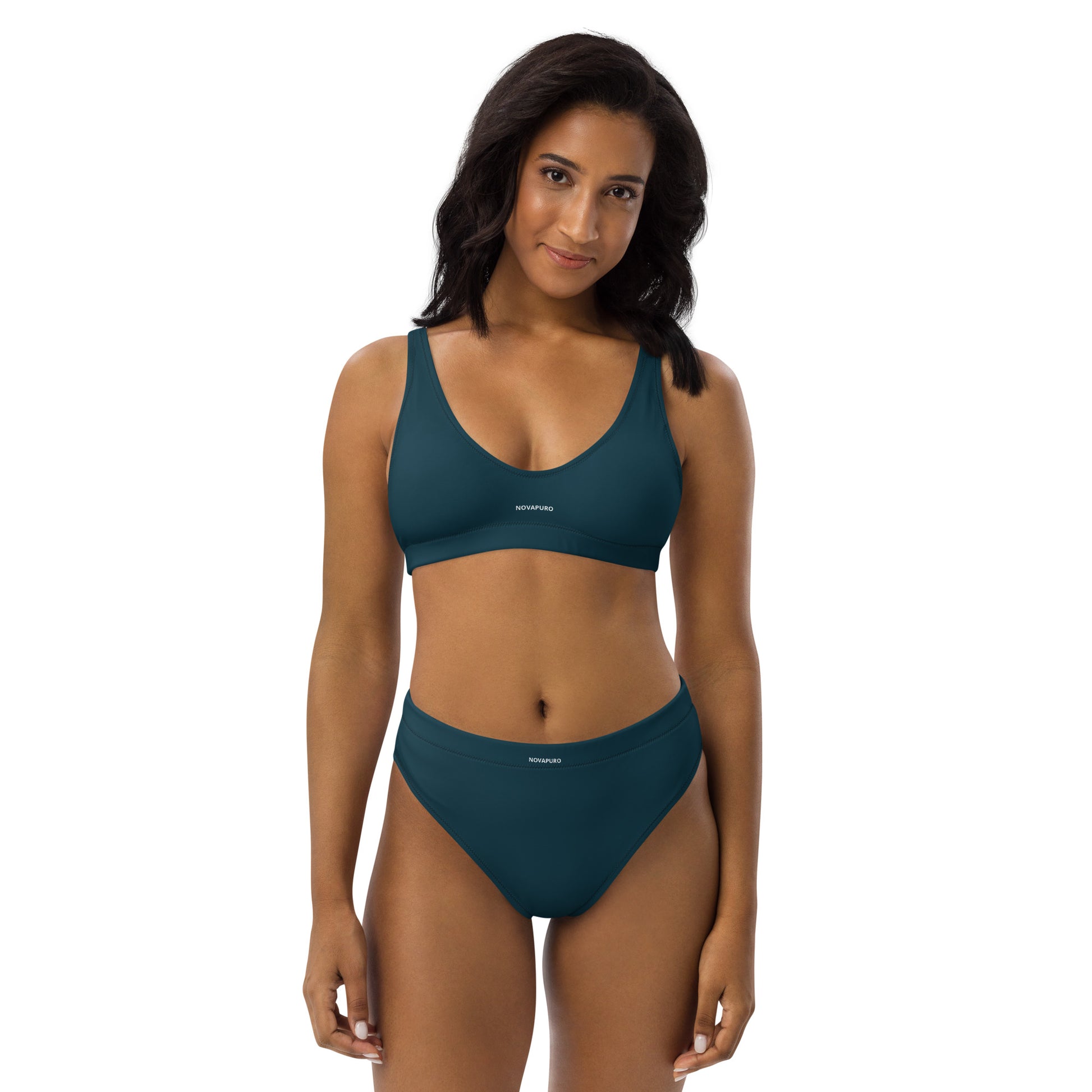 Model wearing dark blue Novapuro Signature recycled bikini set