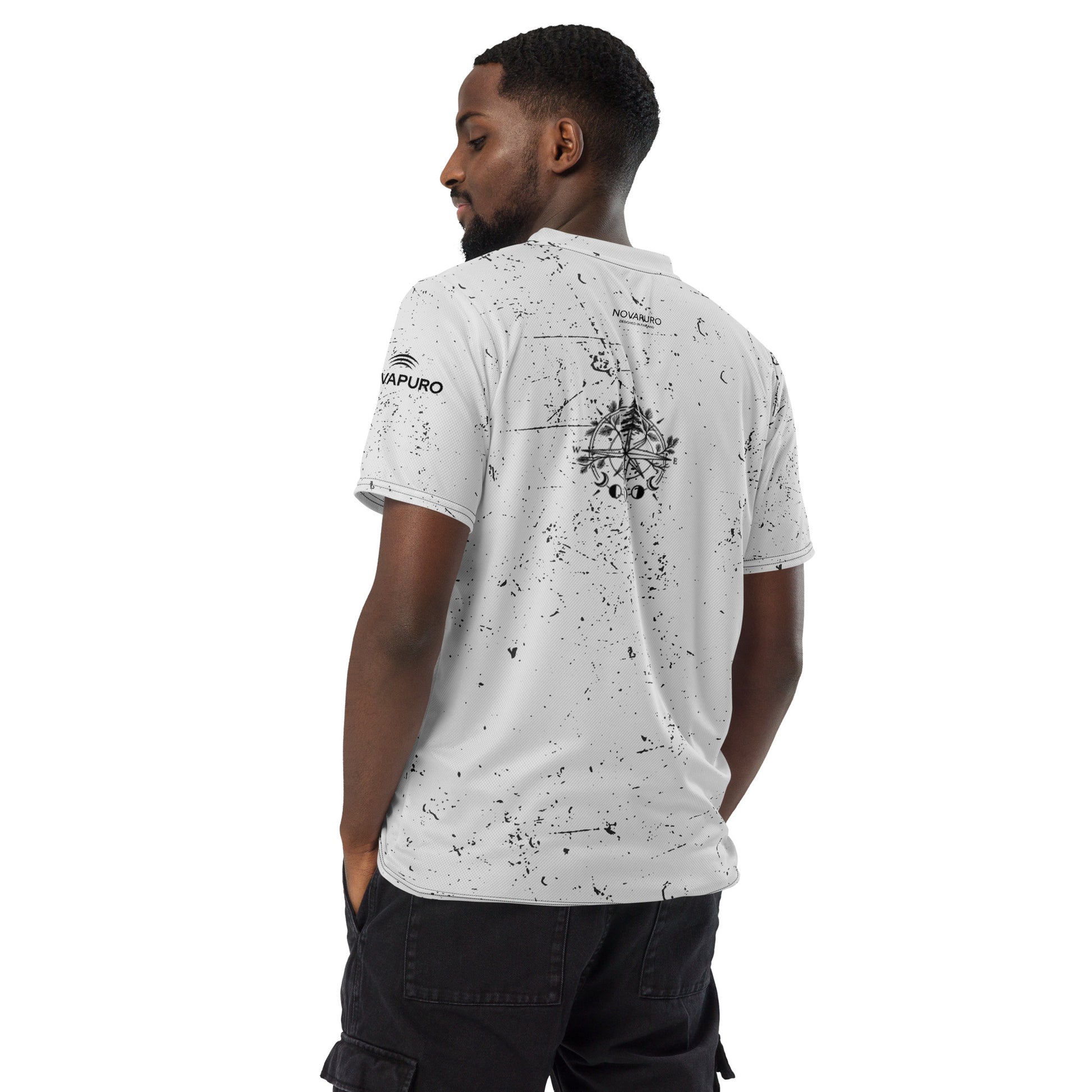 Man wearing the sustainable Nordic Compass recycled sports jersey from the back, showing the minimalist nature graphic.