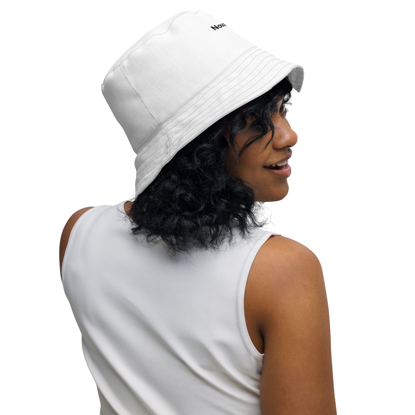 Versatile minimalist reversible bucket hat showcasing a clean Nordic aesthetic and abstract Spring Ice pattern, designed for sustainable streetwear by Novapuro