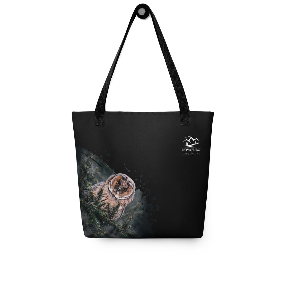 A person carrying the black Novapuro x Jarno Virtanen tote bag featuring a Nordic long-eared owl chick print on the lower side.