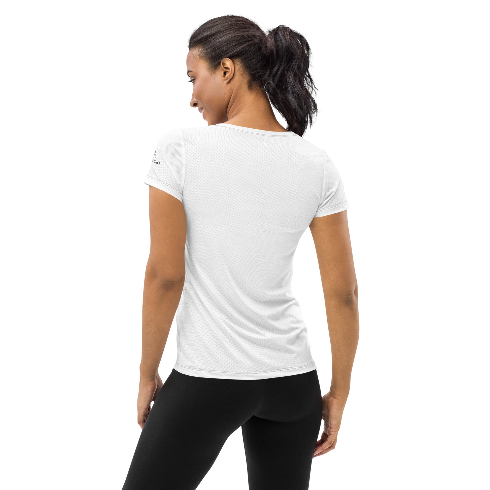 Woman wearing white Novapuro athletic t-shirt with Create Your Own Pace text, minimalist activewear design