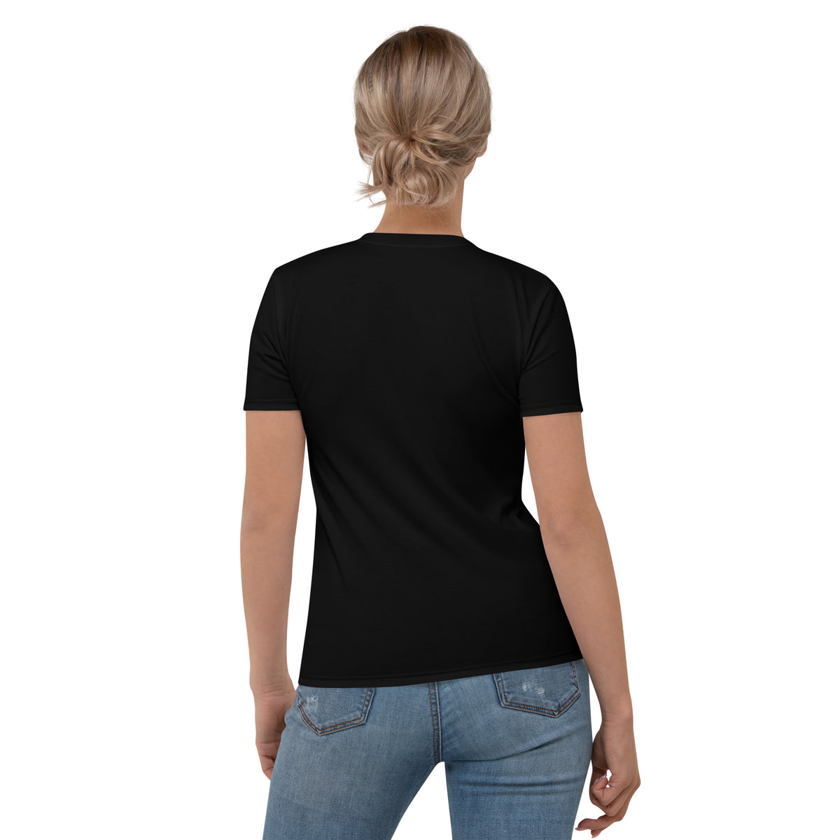 A woman wearing the black Novapuro x Jarno Virtanen women's t-shirt featuring a Nordic long-eared owl chick print on the lower side.