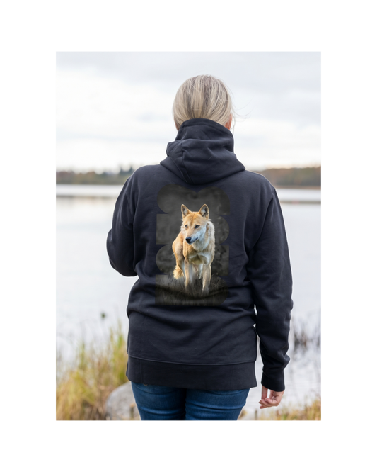 Black organic cotton hoodie featuring a majestic Nordic wolf design on the back, a sustainable collaboration between Novapuro and Auli Leivonen.
