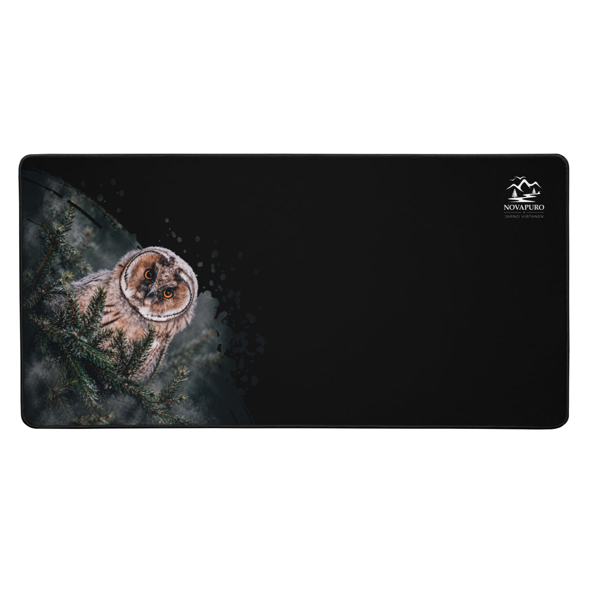 A black Novapuro x Jarno Virtanen desk mat featuring a Nordic long-eared owl chick print on the left side and a small logo on the right.