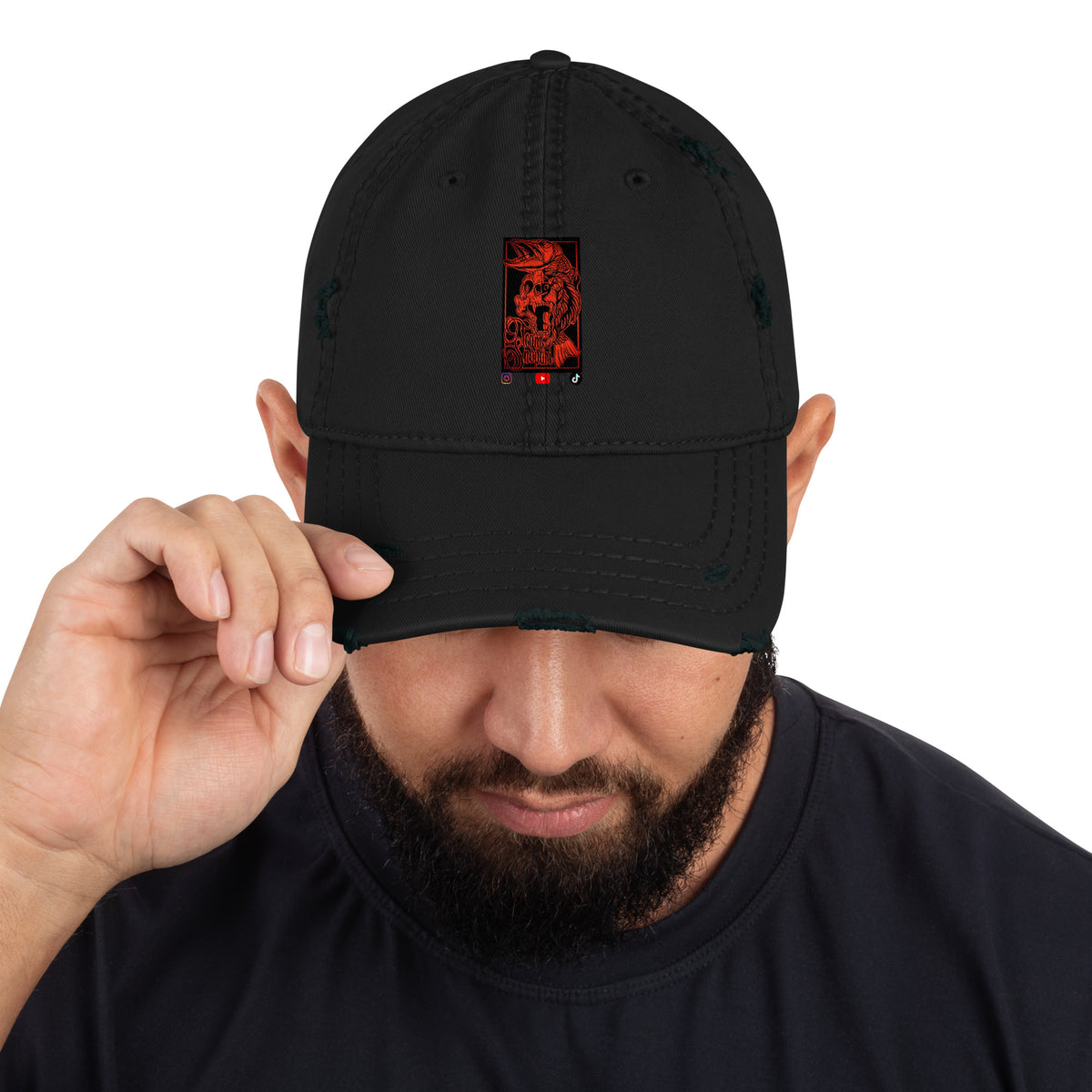 A person wearing the black Team Snöpäri distressed dad hat with red logo embroidery, casual Nordic fashion.