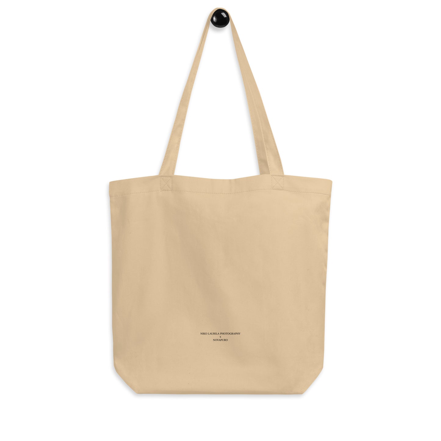 Back view of the natural eco tote bag with custom minimalist Niko Laurila x Novapuro co-branding