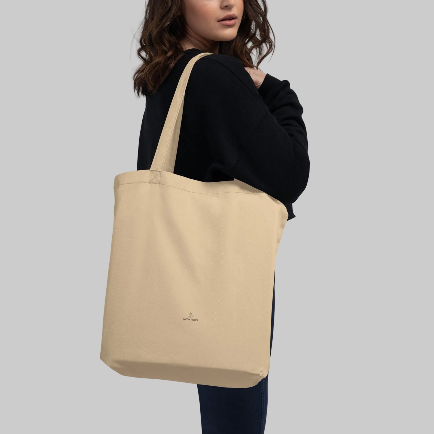 Back of the organic cotton Novapuro tote bag featuring a small minimalist logo