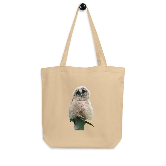 Front view of a sand-colored organic cotton tote bag featuring stippling art of a Long-eared Owl by Mikko Monto.