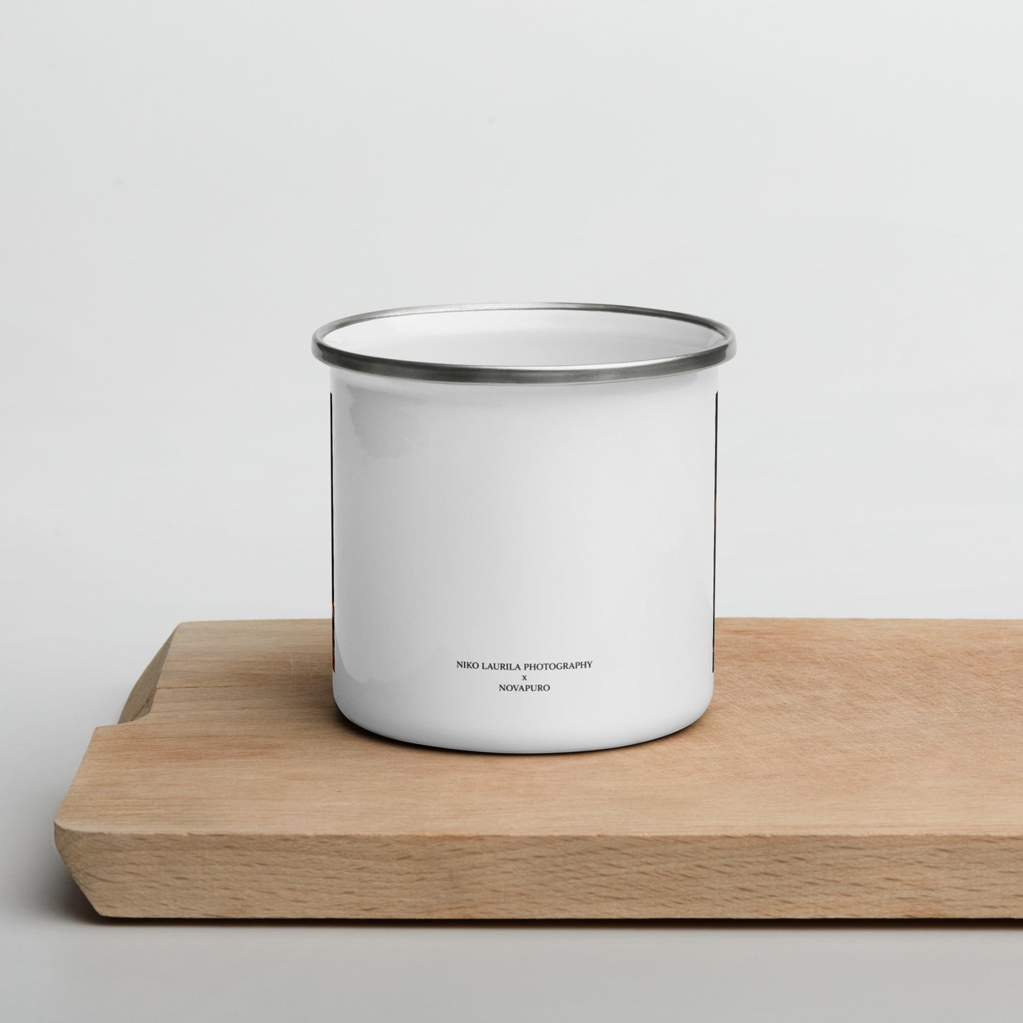 Niko Laurila x Novapuro white enamel camper mug featuring an original red fox wildlife photograph resting on a wooden board