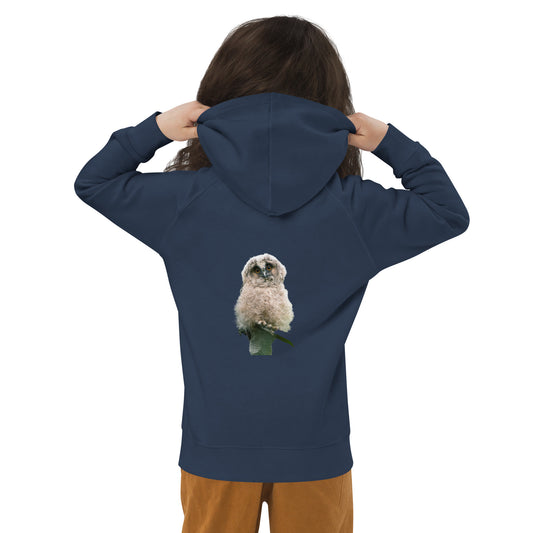 Back view of a child wearing a navy blue organic hoodie featuring a stippling art print of a Long-eared Owl by Mikko Monto.