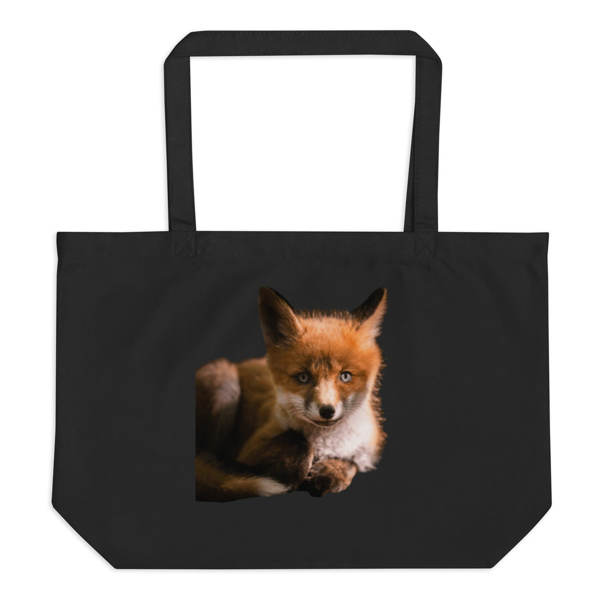 Front view of the spacious black organic cotton tote bag featuring the 'Wild Fox' wildlife photography print by Niko Laurila.   