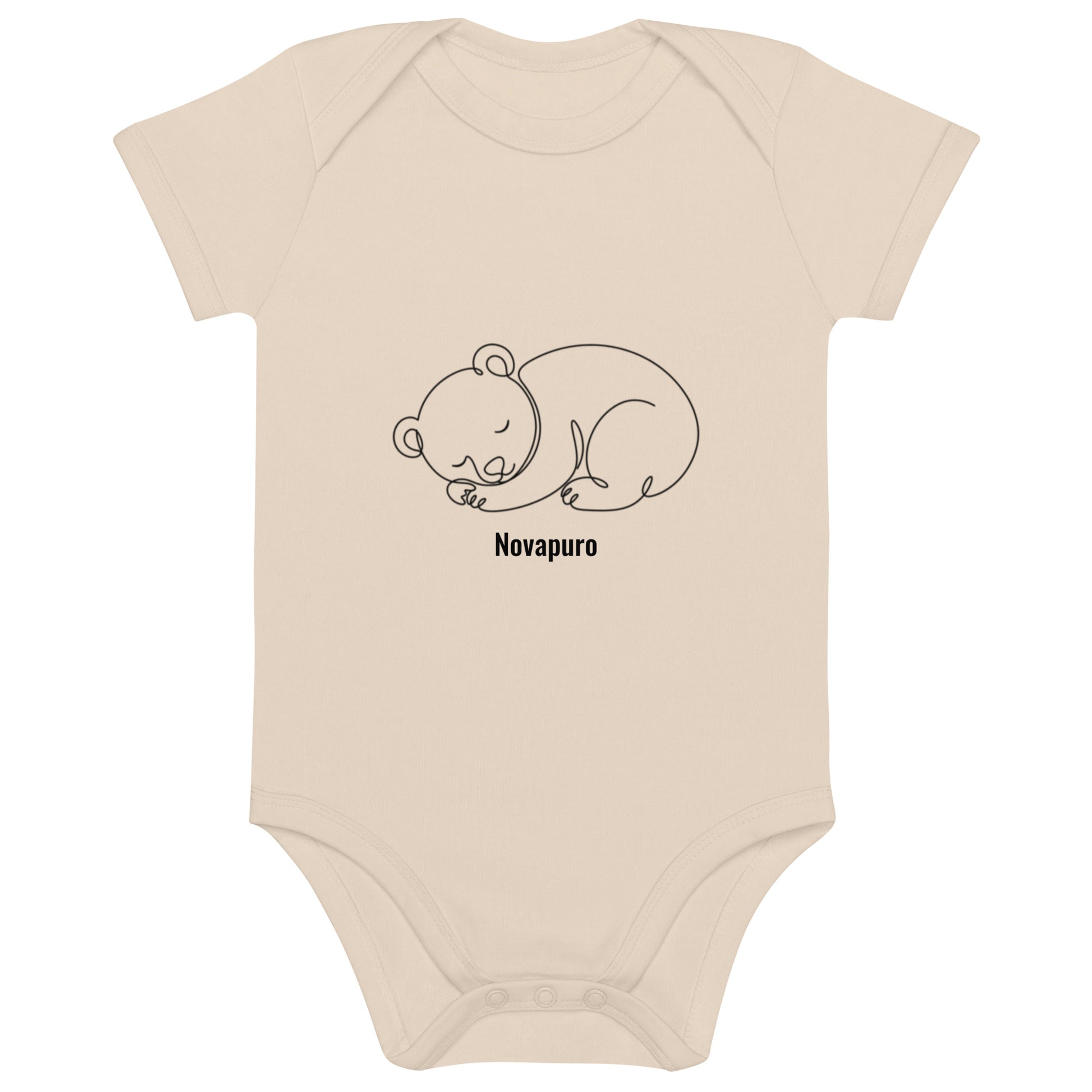 Baby wearing a sand-colored organic cotton bodysuit featuring a minimalist continuous line art of a sleeping bear and the Novapuro logo.