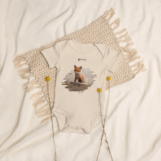 Organic cotton baby bodysuit in natural white featuring an authentic Guardian Fox Kit wildlife illustration by Novapuro x Jarno Virtanen, styled flat lay