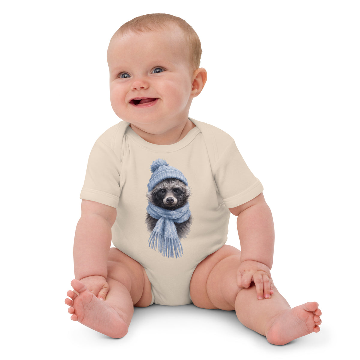 Happy baby wearing the Organic Natural Annette Thome Marttinen x Novapuro organic cotton baby bodysuit featuring Nordic wildlife artwork