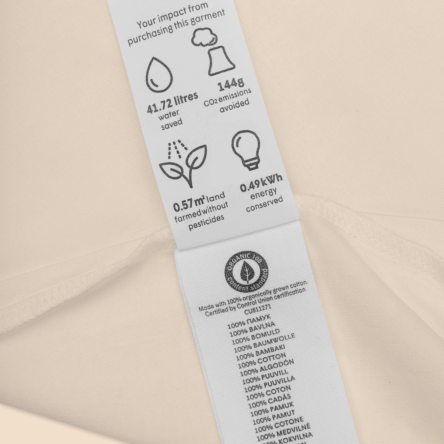 Detail shot of the Novapuro baby bodysuit certifications and eco-friendly organic cotton labeling