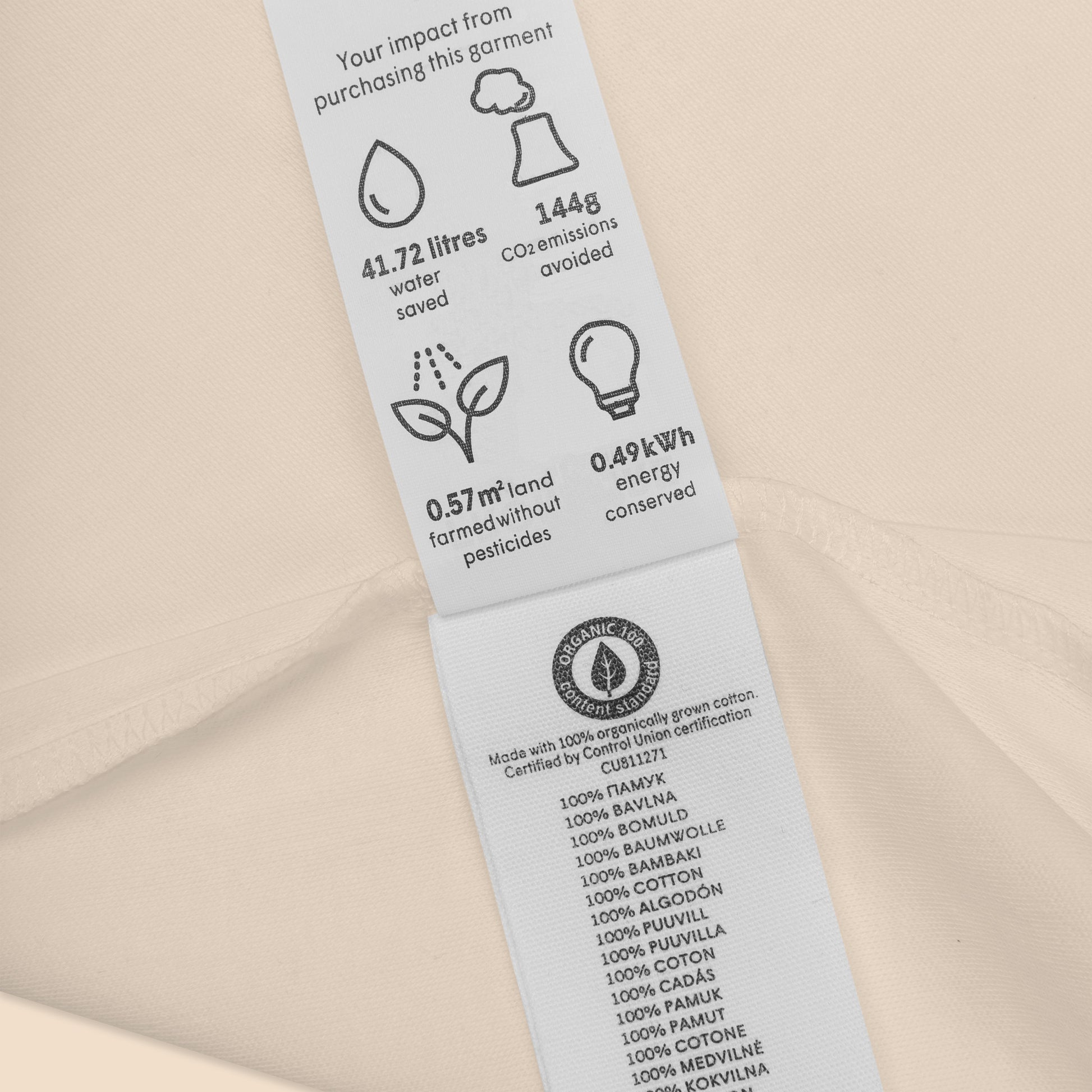 Detail shot of the Novapuro baby bodysuit certifications and eco-friendly organic cotton labeling