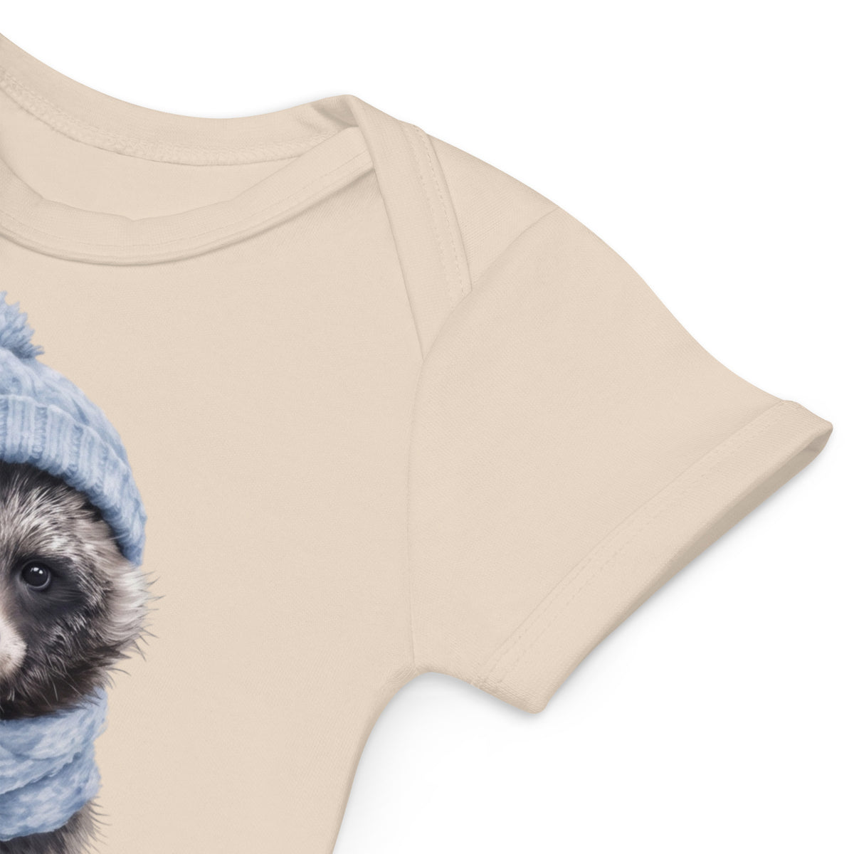 Side folded view of the sustainable Annette Thome Marttinen x Novapuro organic baby bodysuit