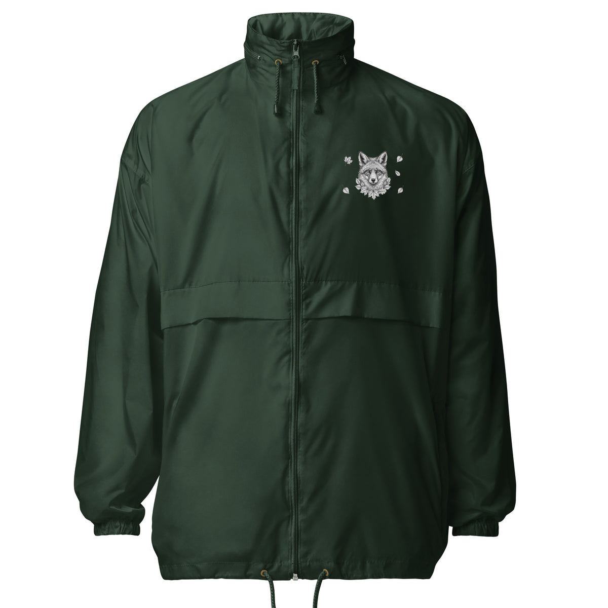 A smiling woman wearing the dark green Novapuro x Annette Thomé-Marttinen 'Nordic Fox' windbreaker jacket, featuring a minimalist white fox illustration on the chest.