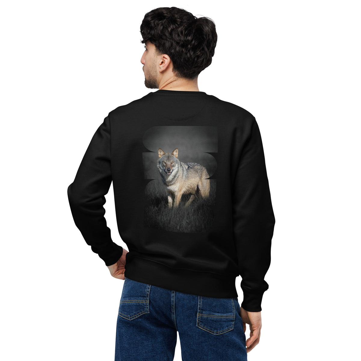 Male model wearing a black unisex organic cotton sweatshirt featuring the striking Dark Alpha Wolf back print. Sustainable Nordic nature apparel by Novapuro.