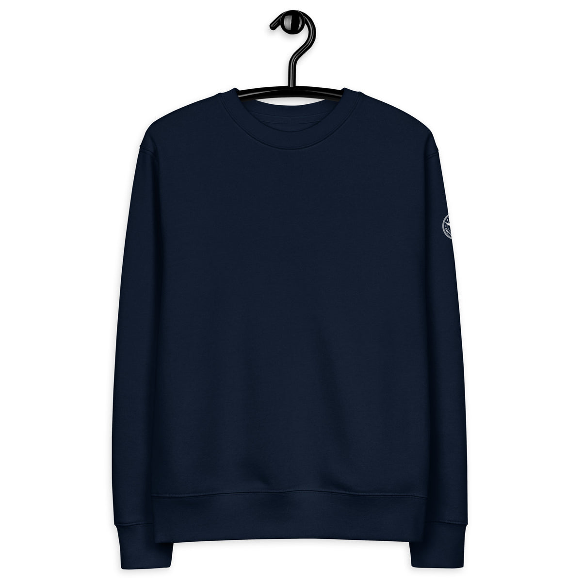 A person wearing the dark navy Novapuro x Annette Thomé-Marttinen 'Nordic Night Sky' organic sweatshirt, featuring a beautiful photograph of a starry night and a shooting star over a calm lake.