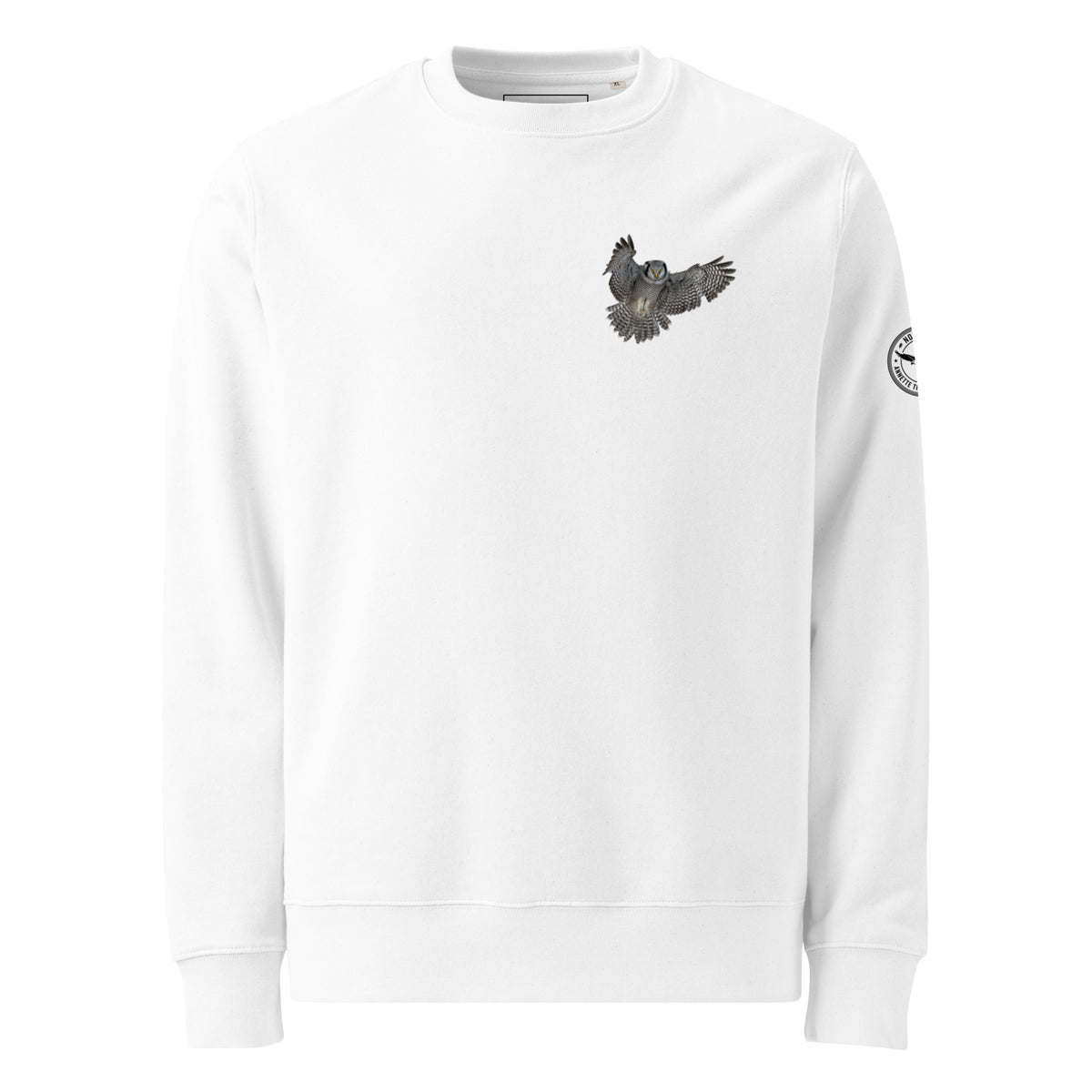 Front view of a person wearing a white unisex organic eco sweatshirt featuring a small Northern Hawk Owl print on the left chest by Annette Thome Marttinen x Novapuro.