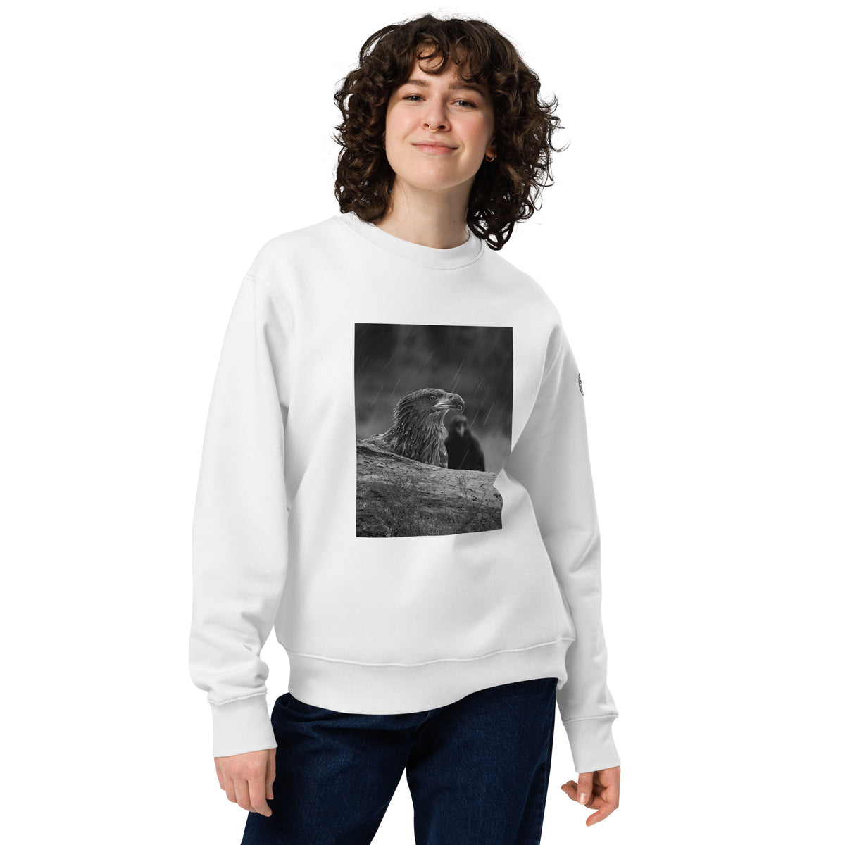 Crisp white unisex organic cotton sweatshirt featuring a minimalist eagle design on the chest, part of the Annette Thomé-Marttinen x Novapuro sustainable clothing collection.