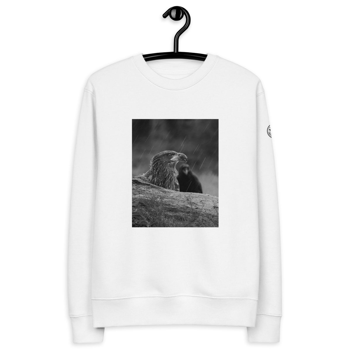 Crisp white unisex organic cotton sweatshirt featuring a minimalist eagle design on the chest, part of the Annette Thomé-Marttinen x Novapuro sustainable clothing collection.
