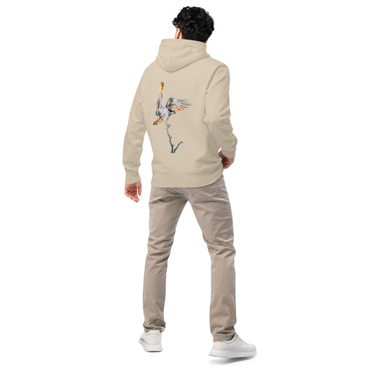 Back view of a model wearing a sand-colored organic hoodie featuring stippling art of an Osprey in flight by Mikko Monto.
