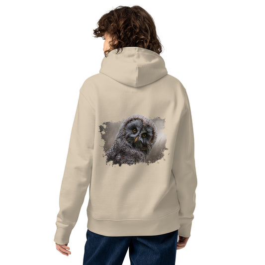 Woman wearing a Desert Dust sand-colored Novapuro x Jarno Virtanen organic hoodie featuring a detailed Great Grey Owl wildlife artwork on the back, studio shot