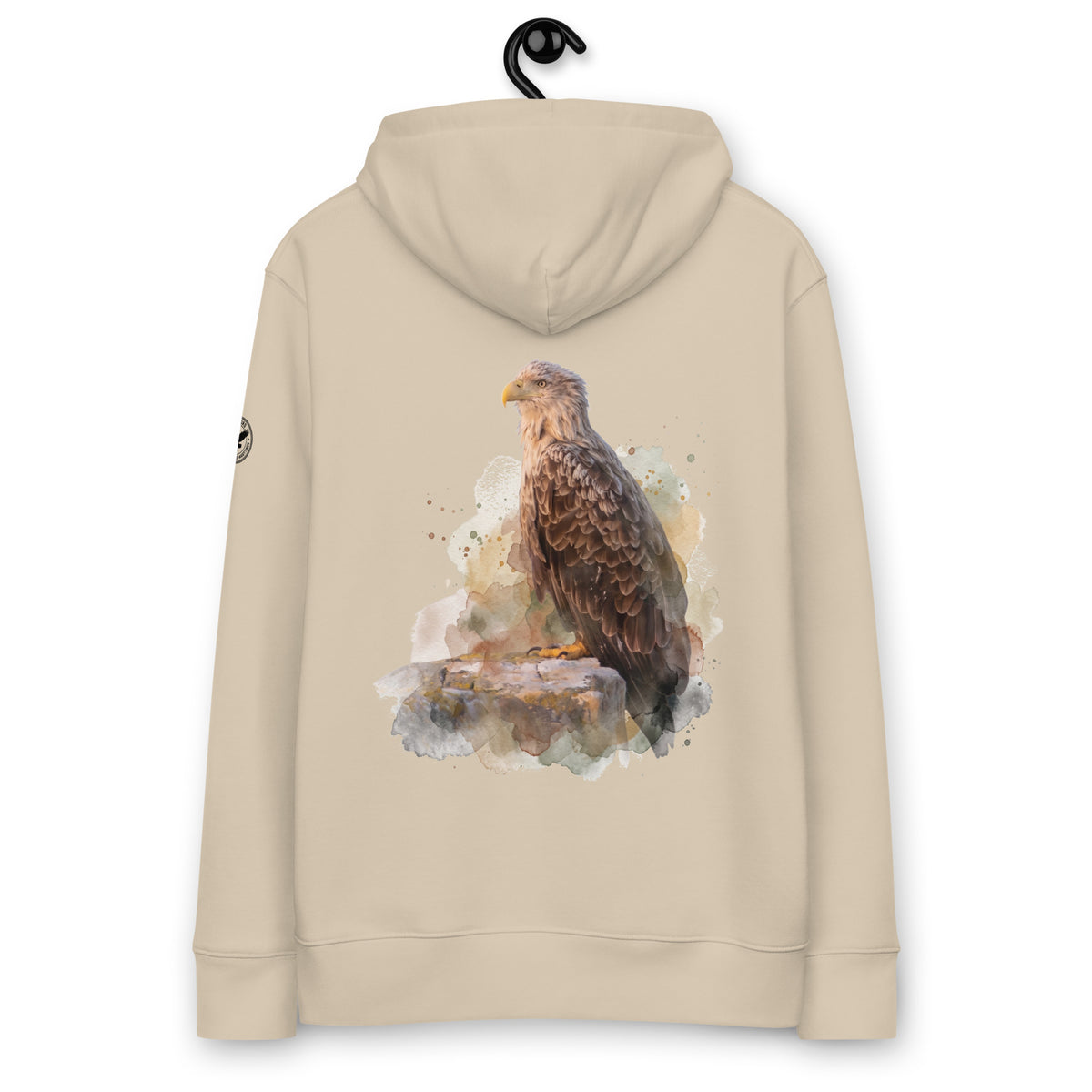 Back view of a person wearing a beige organic eco hoodie featuring a painterly white-tailed eagle wildlife print by Annette Thome Marttinen x Novapuro.