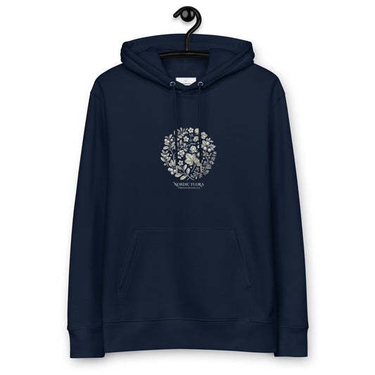 A navy blue premium eco-friendly hoodie featuring a detailed, vintage-style white botanical illustration of Nordic flora on the chest.