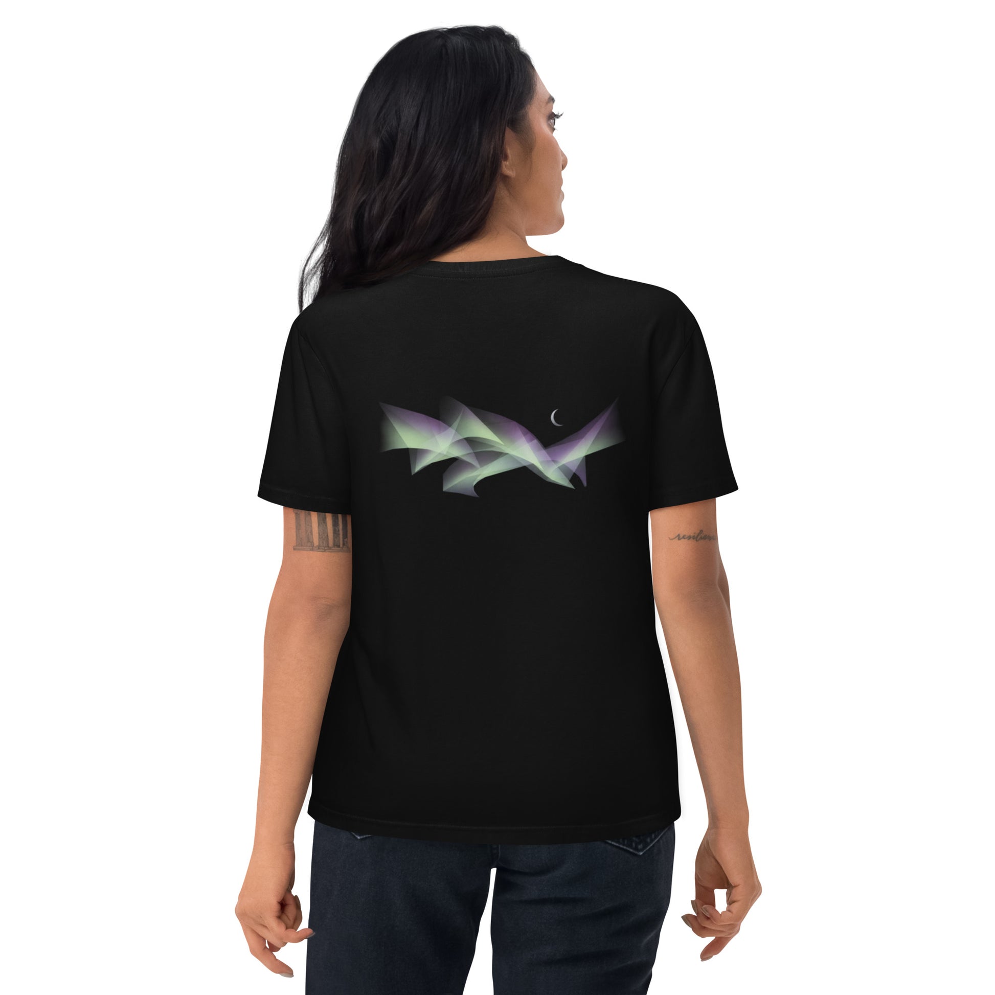 Woman wearing a black Novapuro organic cotton t-shirt featuring an abstract Scandinavian Northern Lights and crescent moon design on the back, studio shot