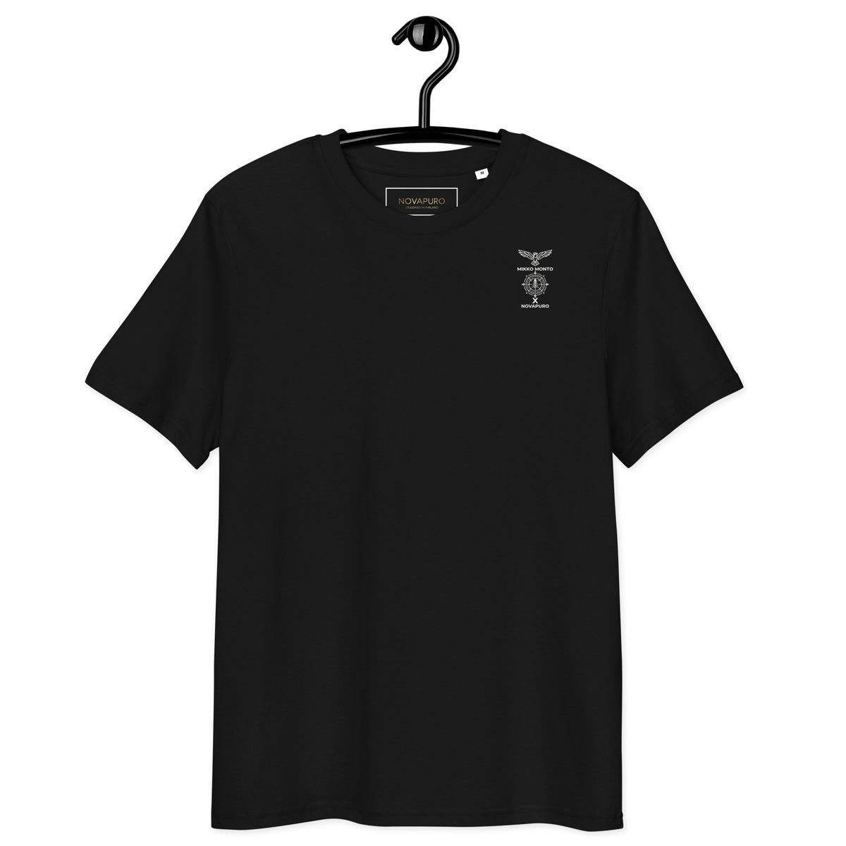 Front view of a person wearing the minimalist black organic cotton t-shirt from the Mikko Monto x Novapuro collection.