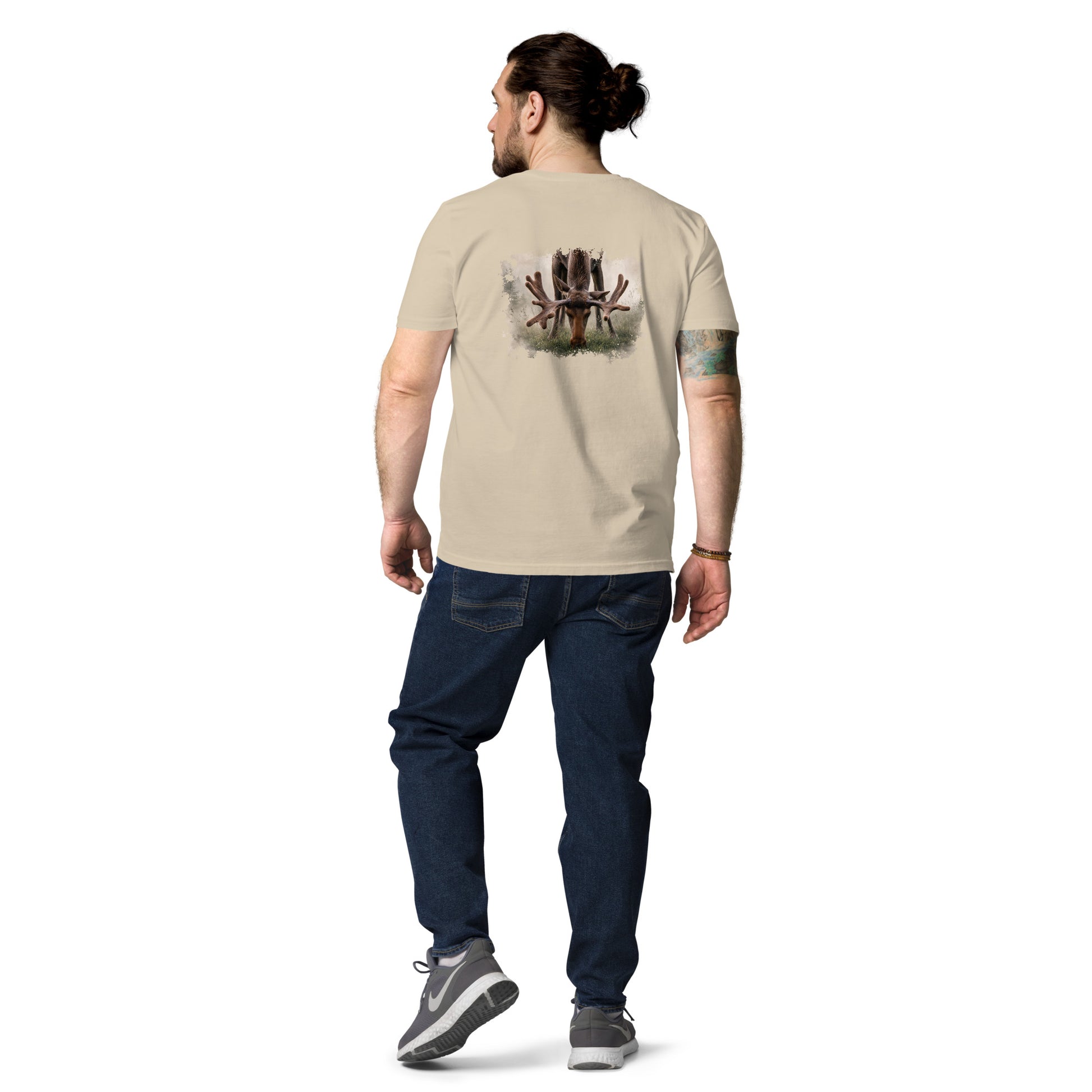 Man wearing a Desert Dust sand-colored Novapuro x Jarno Virtanen organic cotton t-shirt featuring a detailed Nordic moose antlers artwork on the back, studio shot