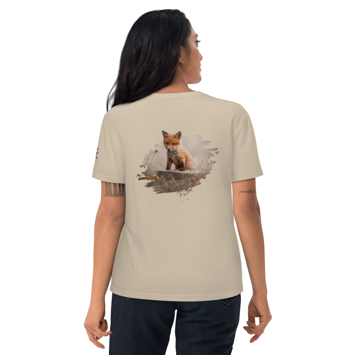 Woman wearing a sand-colored Novapuro organic eco t-shirt with a Fox wildlife print on the back by Jarno Virtanen. Sustainable Nordic apparel.