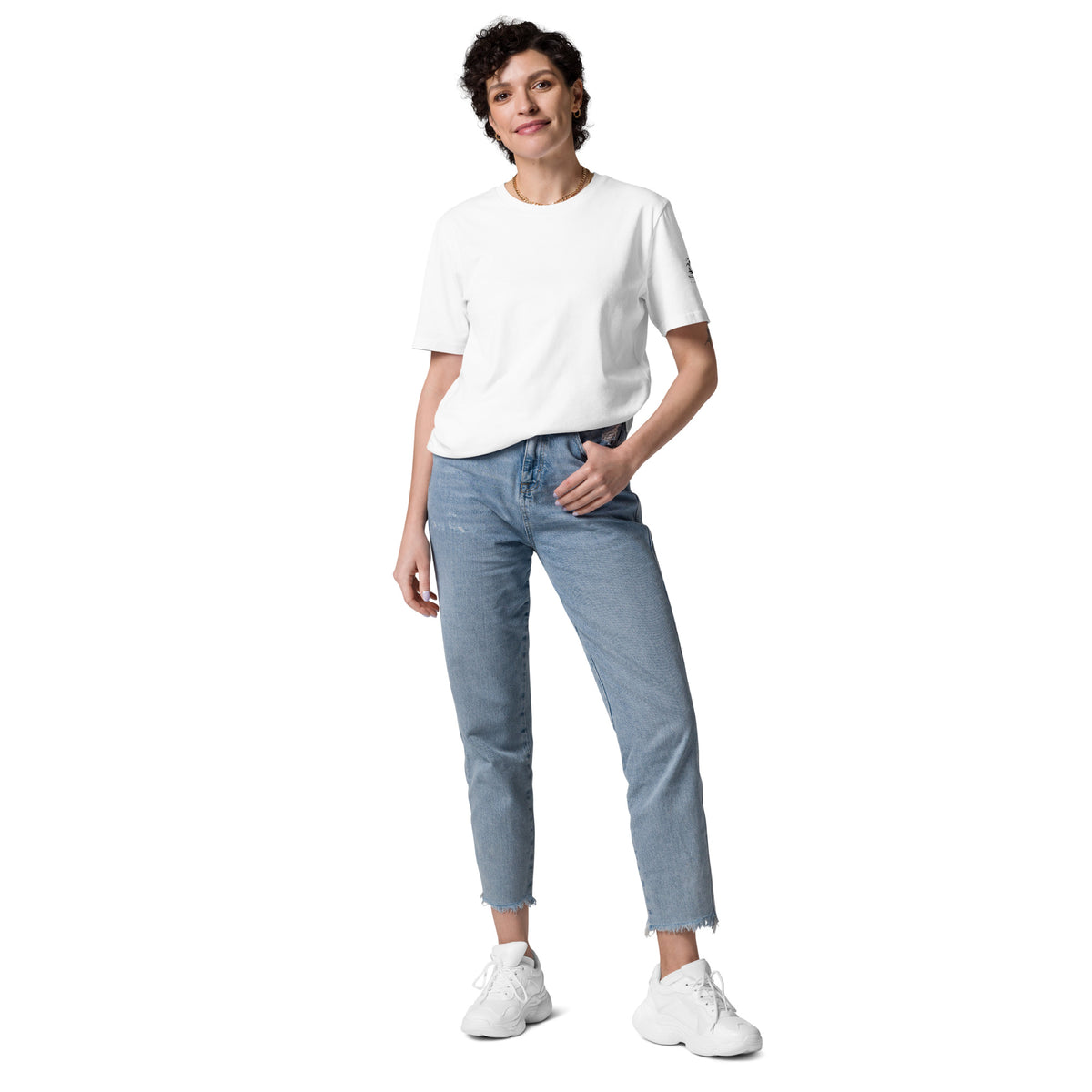 Woman posing in a comfortable and breathable white eco-friendly t-shirt made from premium organic cotton. Minimalist Scandinavian style for everyday wear.