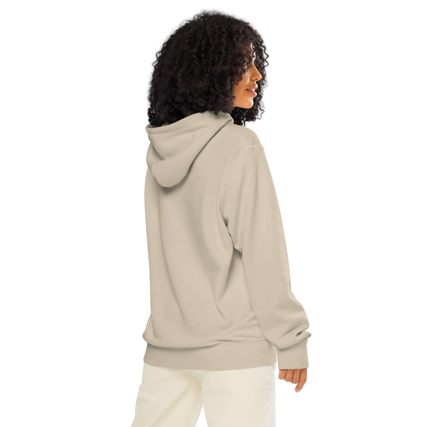 Model wearing a natural beige organic cotton hoodie featuring a minimalist Nordic forest and sunrise graphic by Novapuro