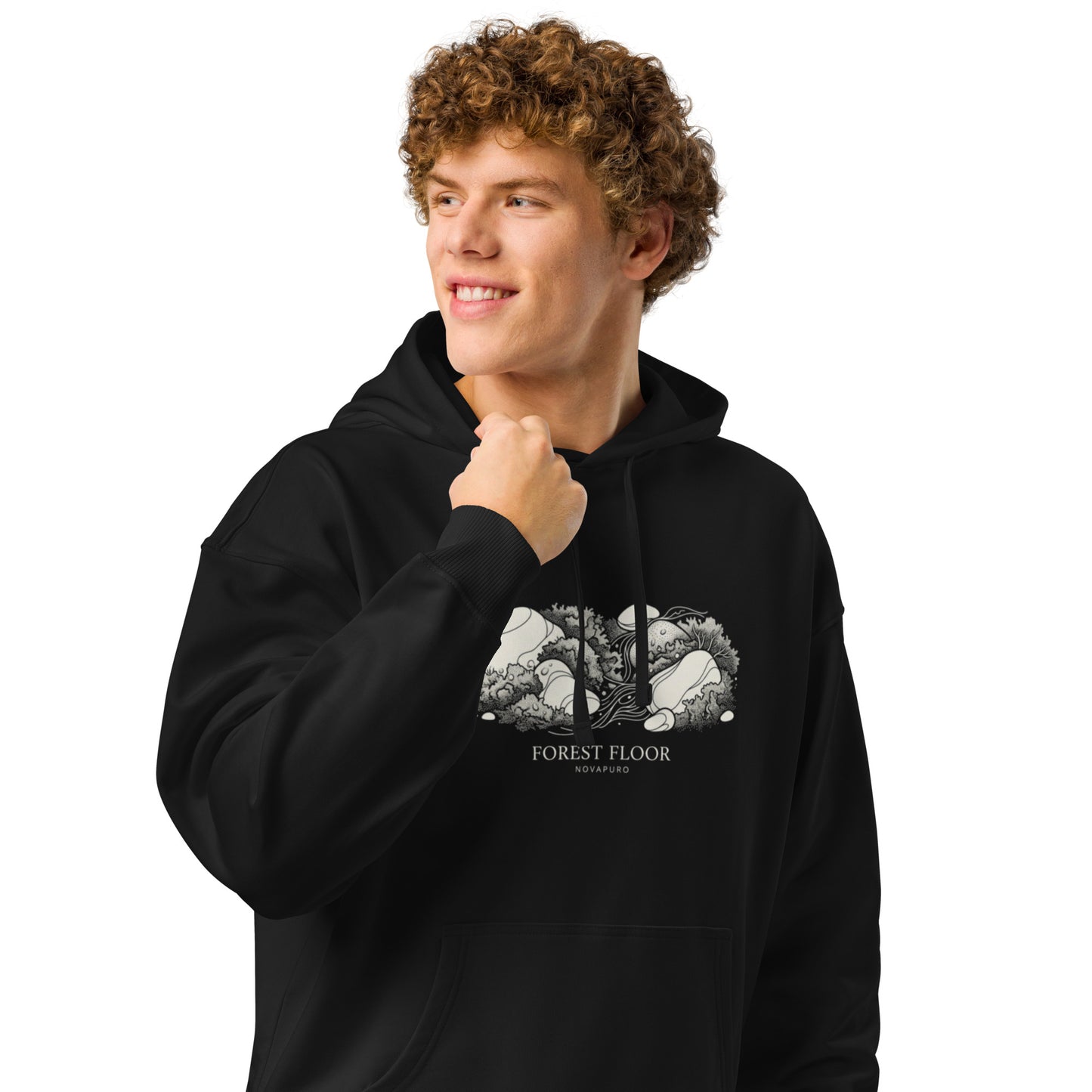 A black premium organic relaxed hoodie featuring a textured white illustration of Nordic forest moss and stones with the text Forest Floor Novapuro.
