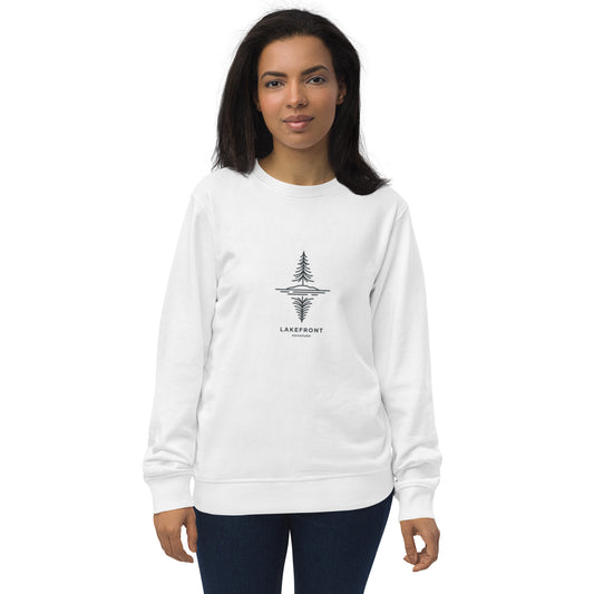 A model wearing a white premium organic sweatshirt featuring a minimalist line art illustration of a pine tree reflecting on a Nordic lake.