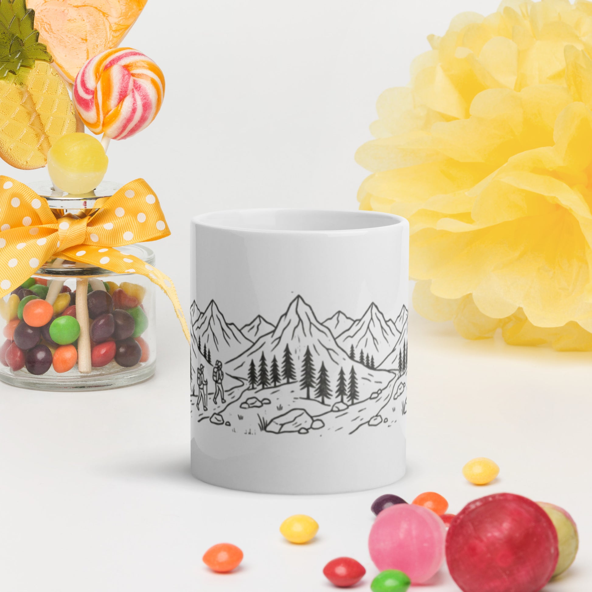 Novapuro Adventure Buddy ceramic coffee mug. Minimalist Nordic design featuring two hikers and mountain landscape. Perfect Valentine's Day gift for nature lovers and hiking friends. White glossy finish.