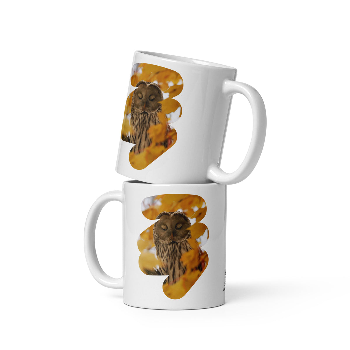 Premium white glossy ceramic coffee mug featuring a fine art nature photograph of a Nordic Ural owl from the Tarja x Novapuro collection.
Woman holding a white ceramic mug featuring a Nordic Ural owl nature photograph from the Tarja x Novapuro collection.