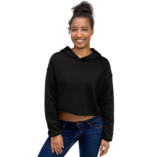 Woman wearing black Novapuro signature cropped hoodie with minimalist sleeve logo