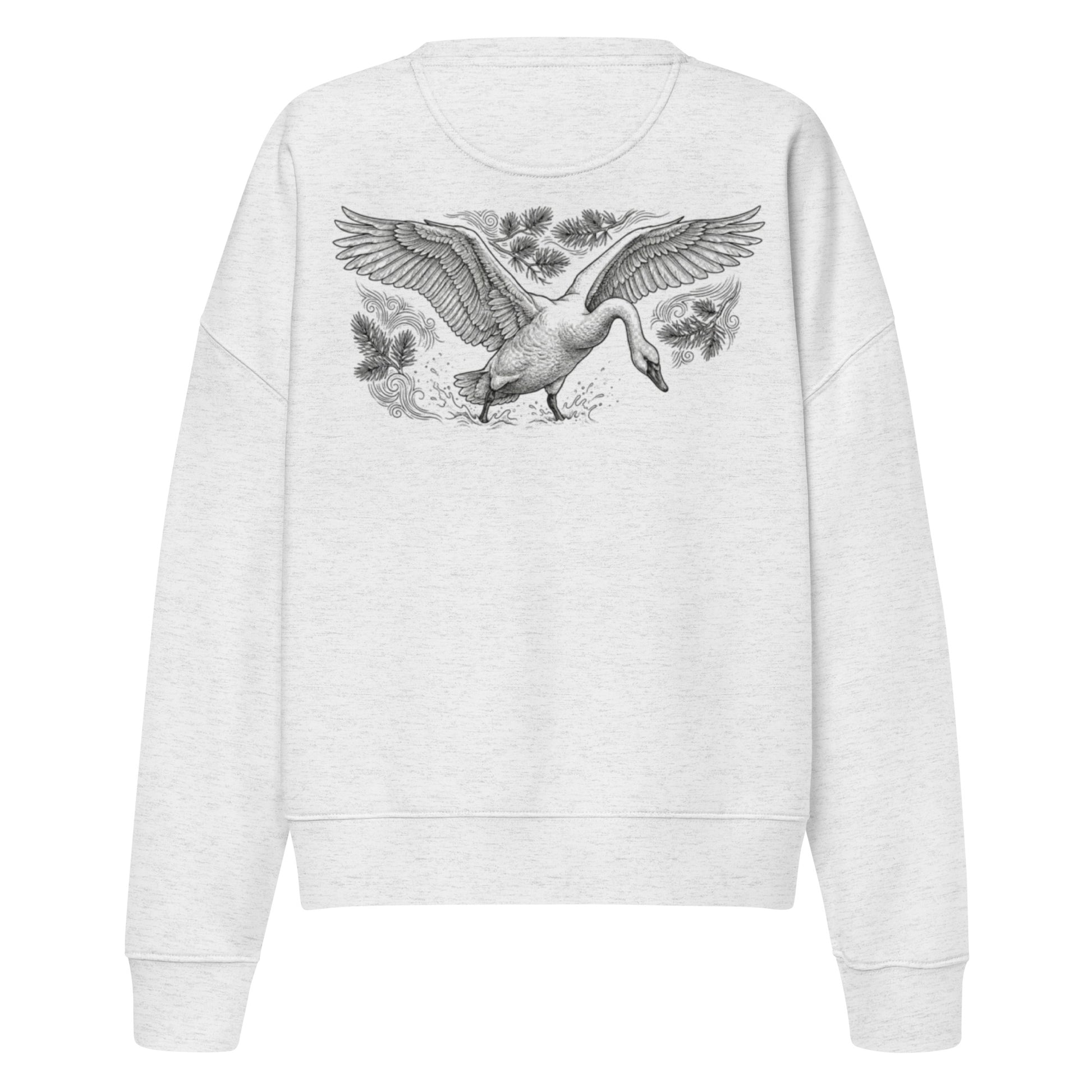 Woman wearing a white organic sweatshirt with a large, intricate illustration of a flying swan on the back. Premium sustainable Nordic fashion.