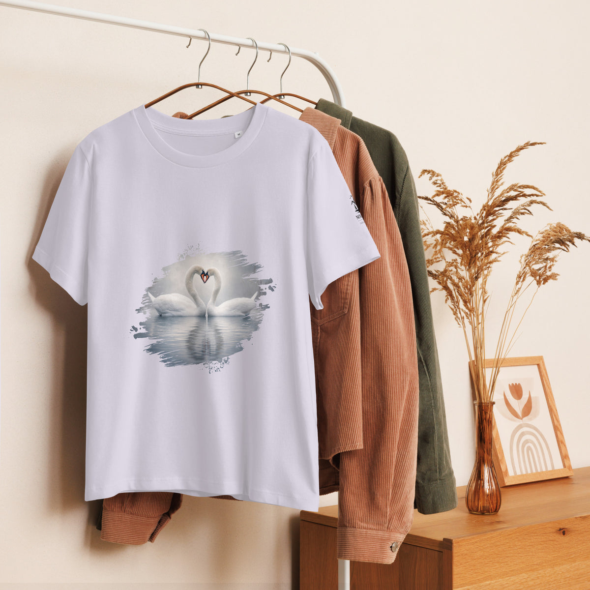 Nordic lifestyle view of the eco-friendly women's swan t-shirt, highlighting its soft Bubble pink color and nature-inspired design.
